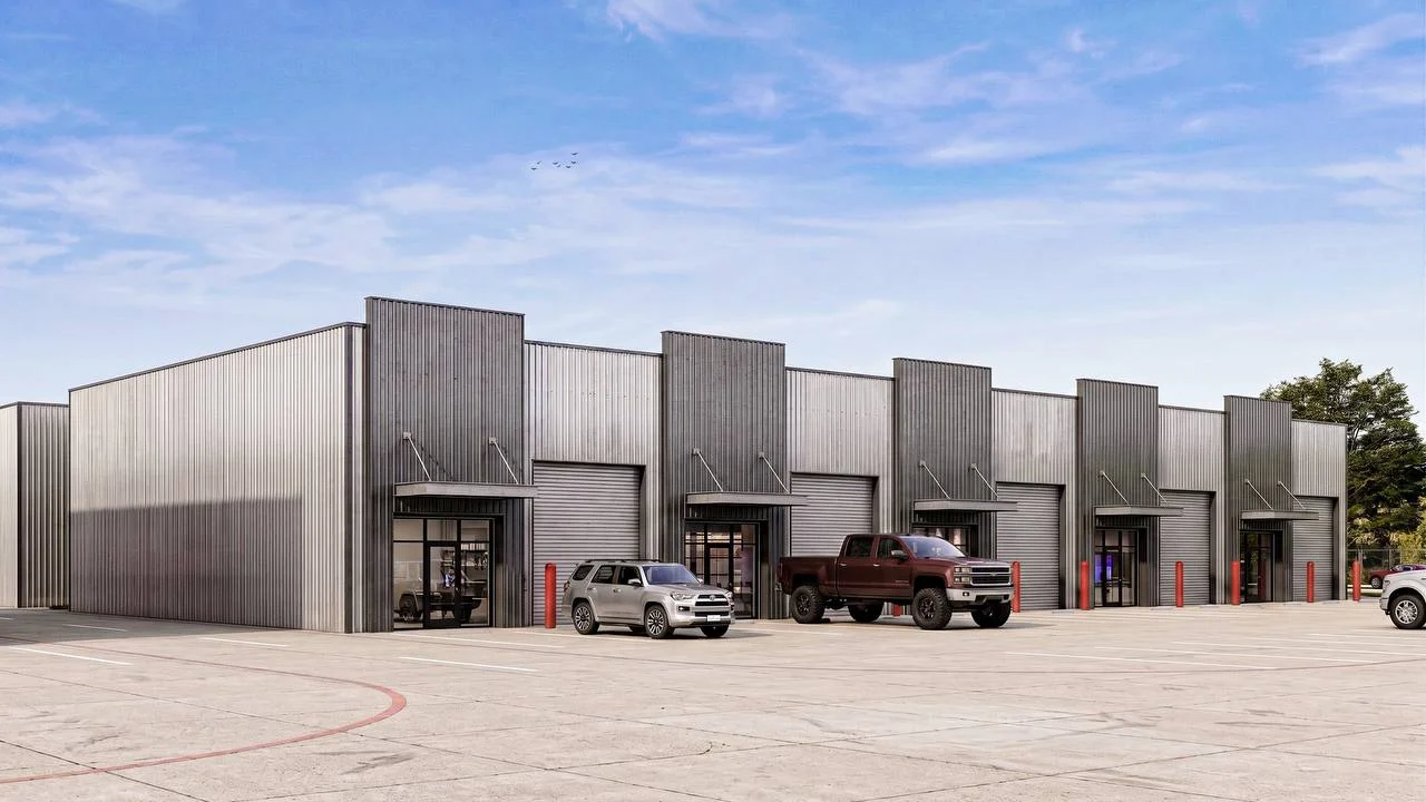 Bammel Phase 1 render — straight-on building elevation, five flex office warehouse suites with storefront office entries and grade-level doors